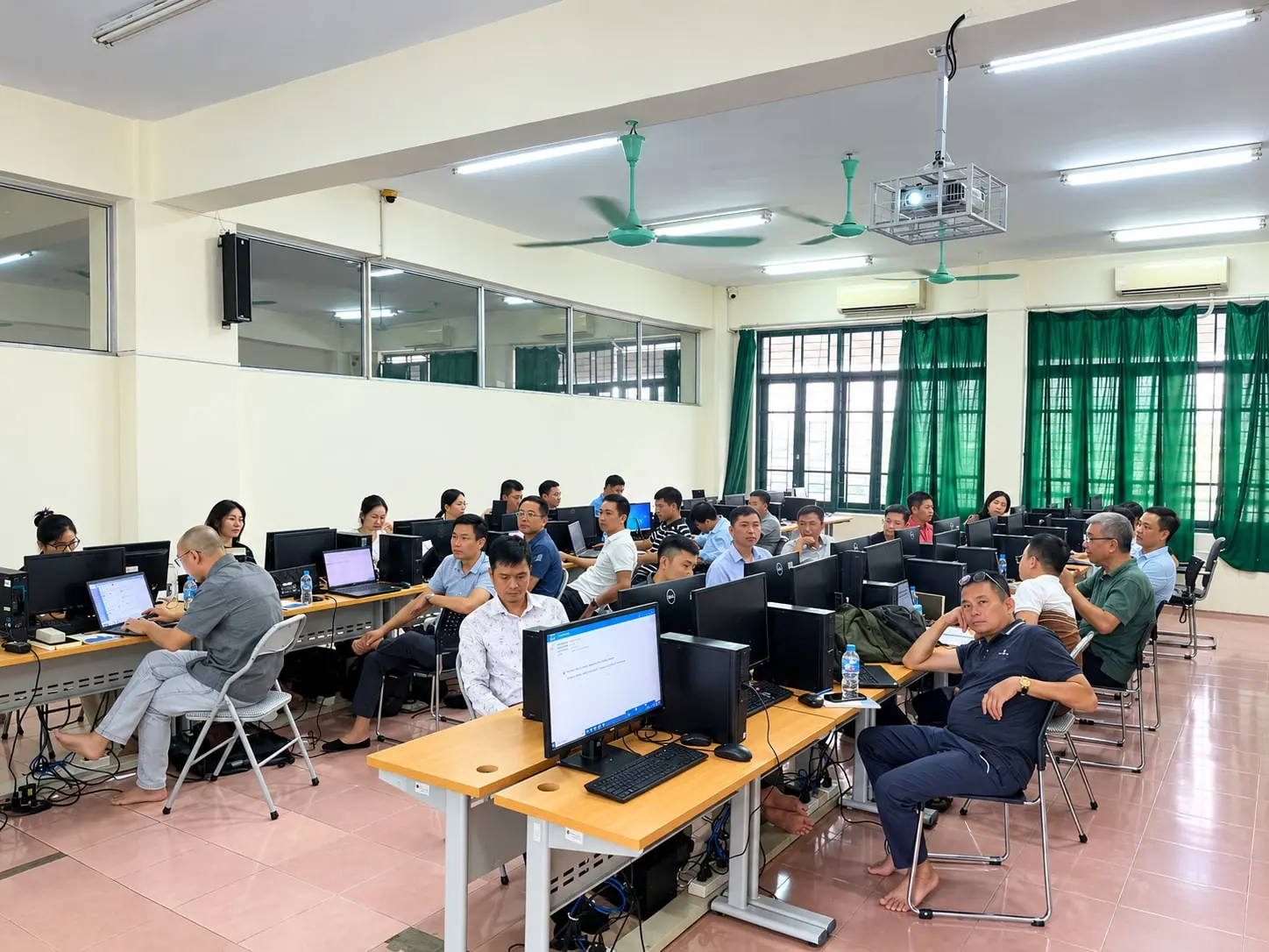 THACONS participants carrying out practical work on computers during a BIM Manager session at Hanoi University of Civil Engineering