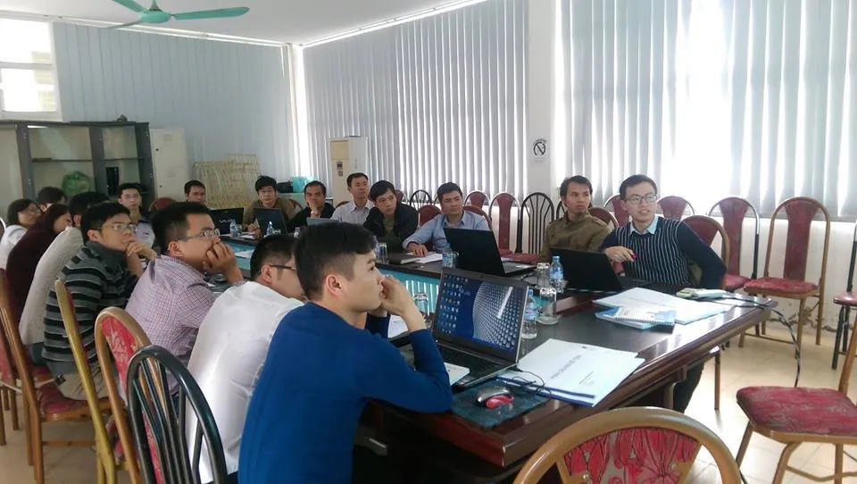 Company engineers following the lecture and working on computers during on-site training