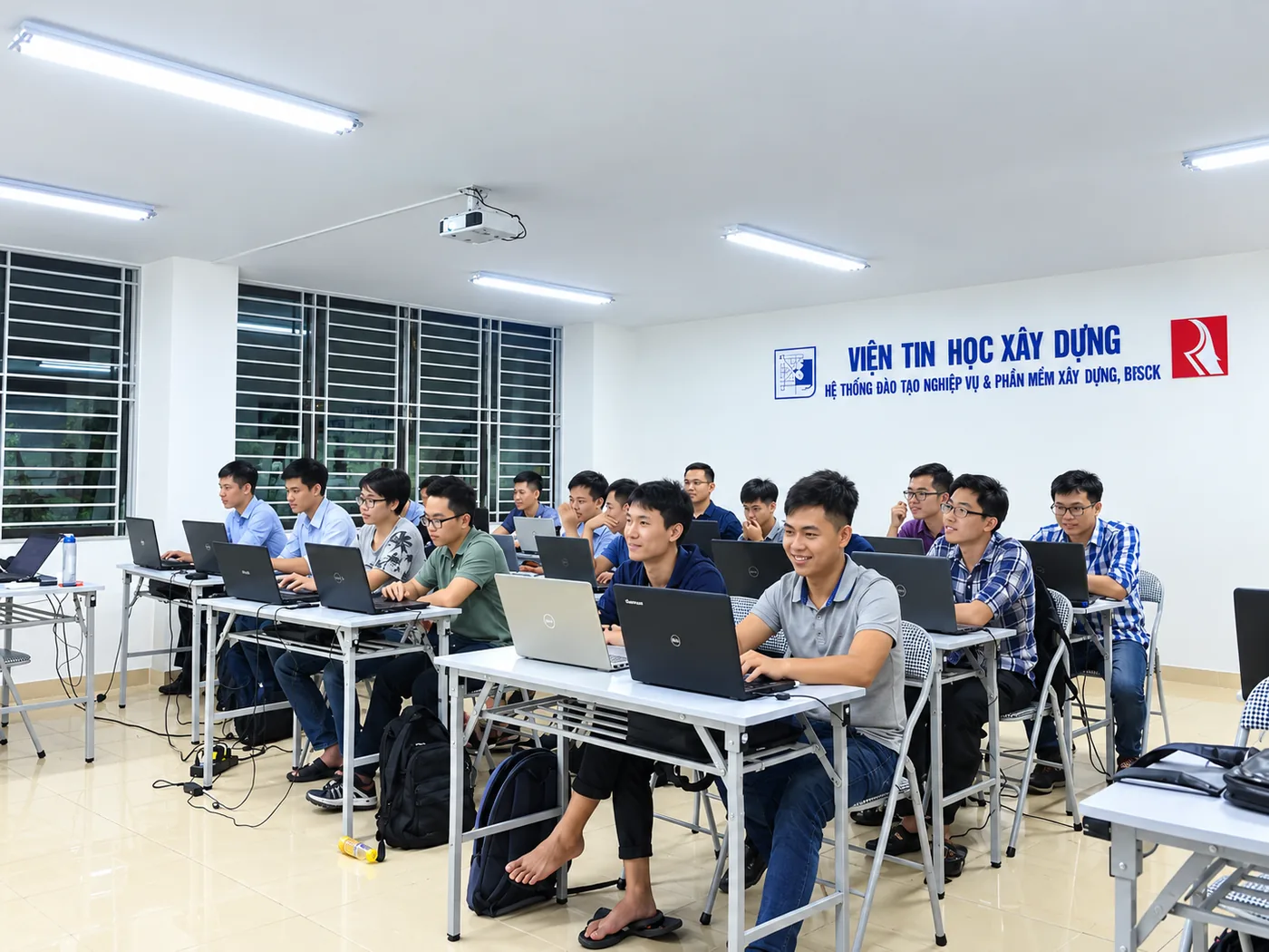 Wide view of a Revit Architecture class at RDSIC, students seated in rows with laptops